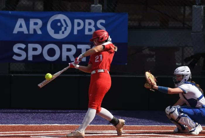 Akayla Barnard connecting on a ball with Abby Gentry catching behind her during the 2023 6A state final. (Photo by Jimmy Jones)